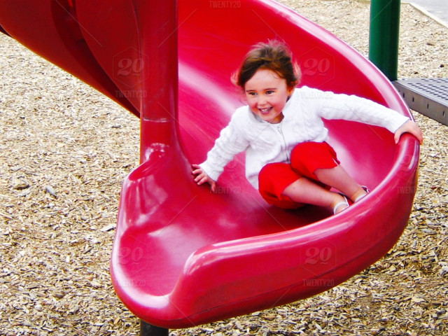 stock-photo-outdoors-excitement-red-summer-playground-fun-child-amusement-park-girl-f6eb4d3e-7464-4d3b-93d0-2ffaf83a3efb